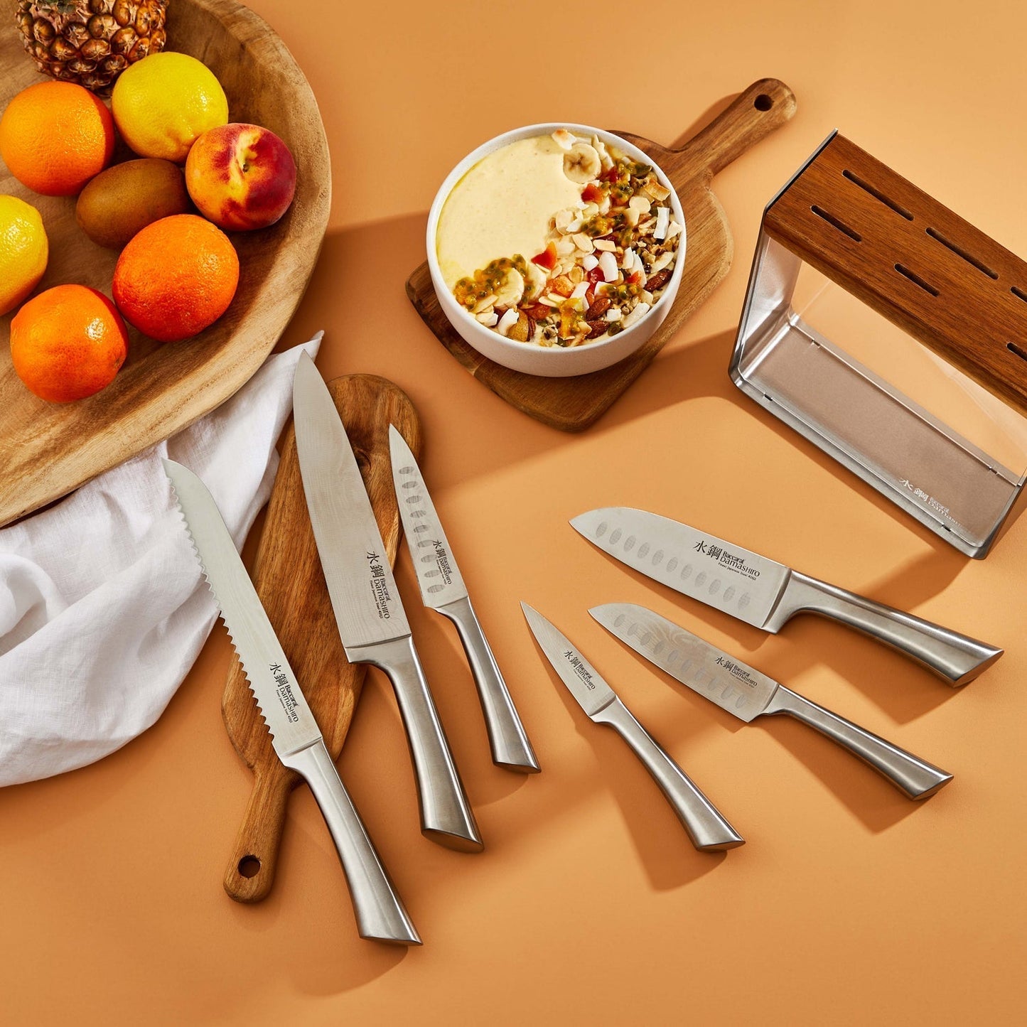 A stunning knife block showcasing sharp elegant blades in fine wood - Baccarat damashiro kinzoku
