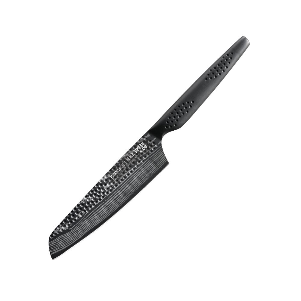 A black santoku knife on a marble surface with scattered green peas - Baccarat id3 Black Samurai