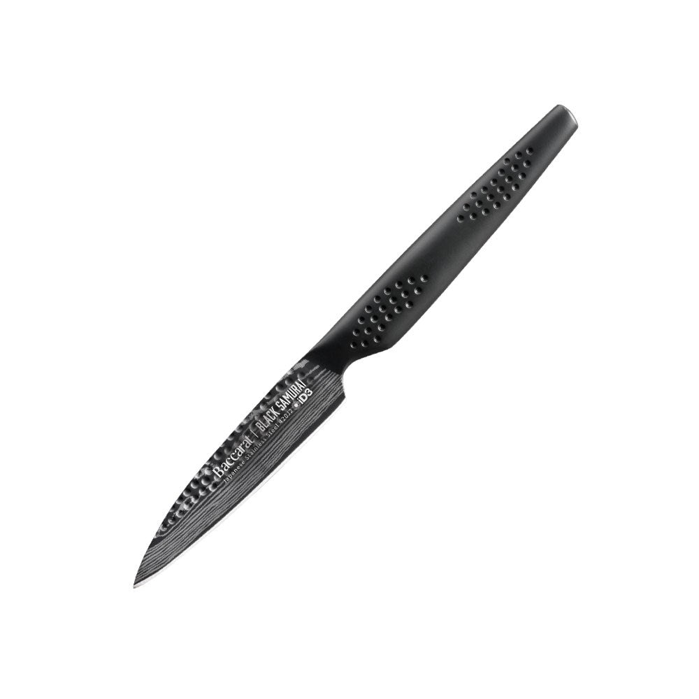 Six elegant Baccarat id3 Black Samurai Paring Knife 9cm arranged with green peas on marble