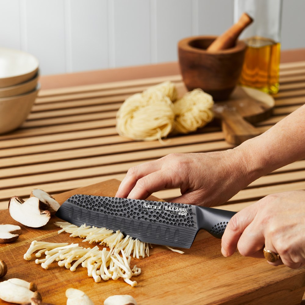 A sharp 11cm utility knife with a textured handle for precision cutting - Baccarat id3 black Samurai