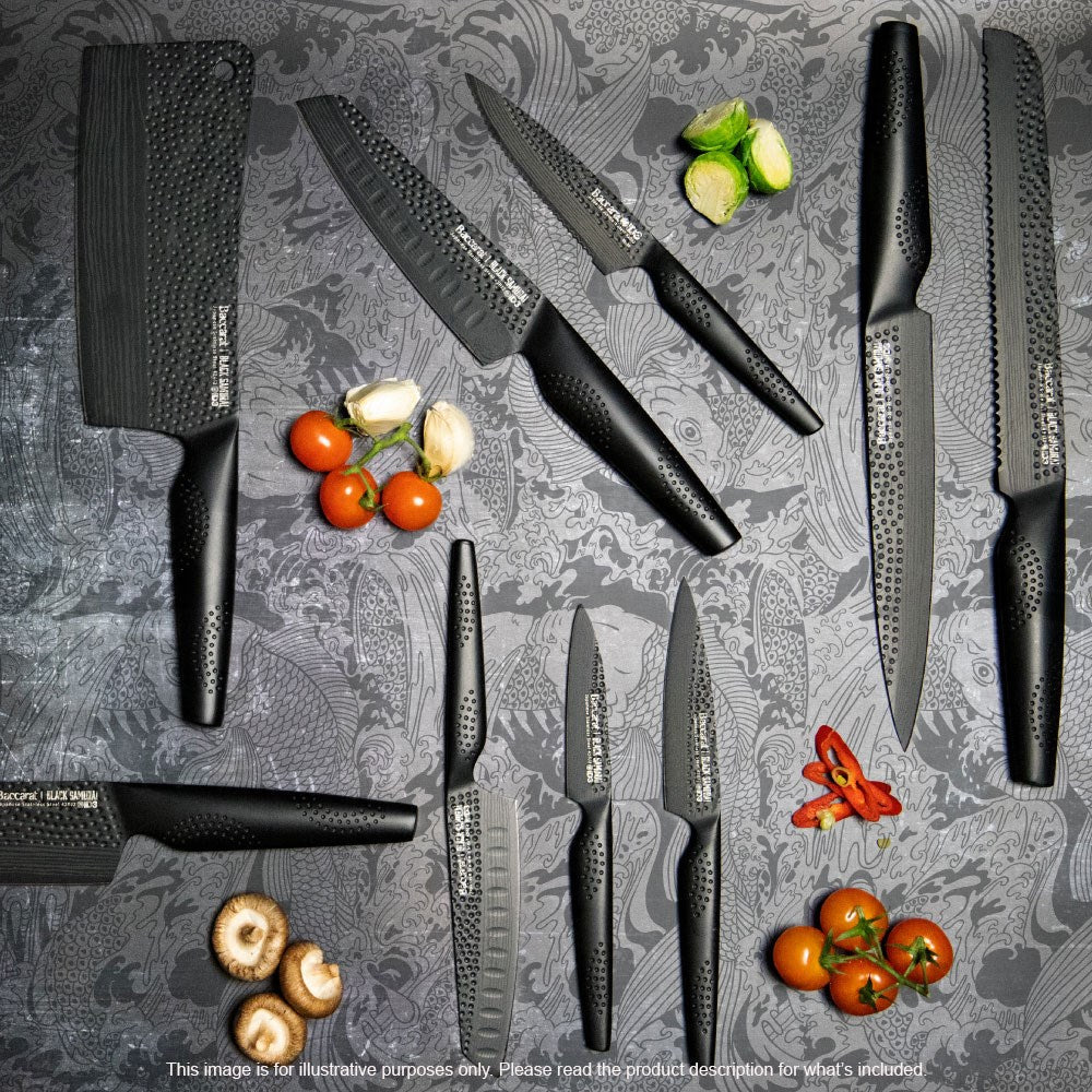 A sharp chef's knife with a black blade and textured handle perfect for precision cutting - Baccarat