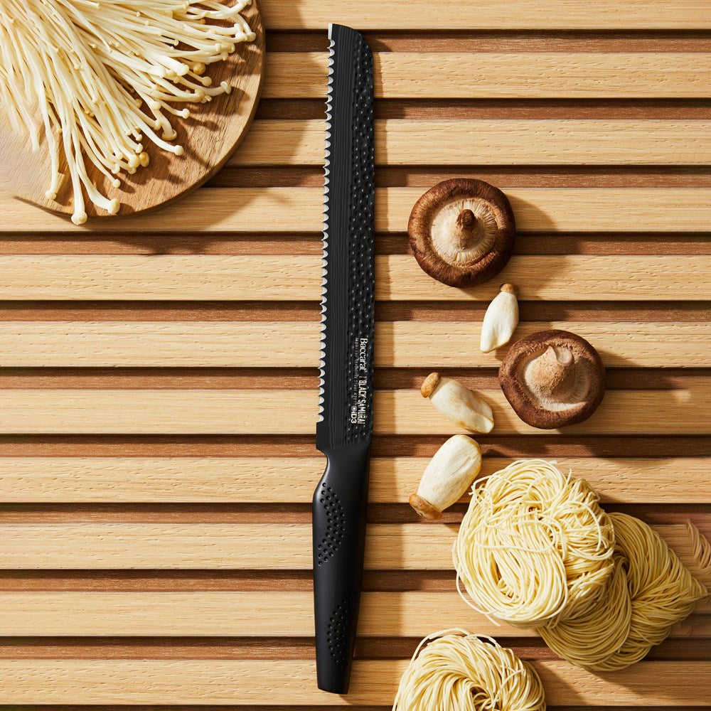 sleek black carving knife on a wooden board with noodles and mushrooms - Baccarat id3 black Samurai