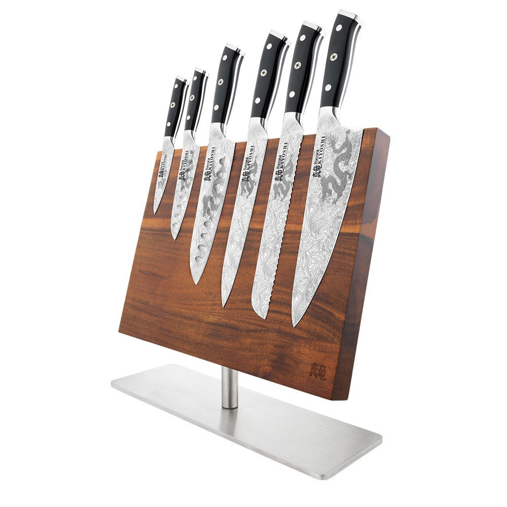 Person chopping ginger and garlic on black cutting board with black Samurai cleaver knife - Baccarat