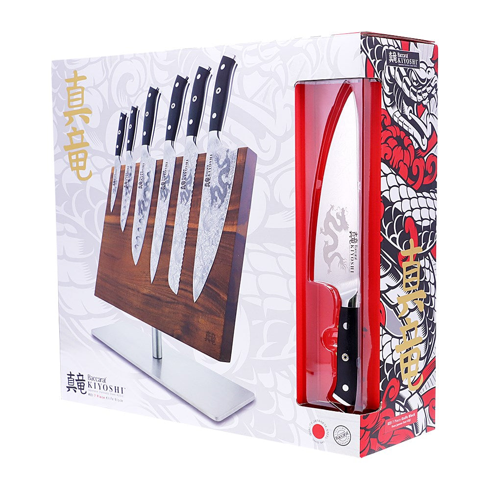 Person chopping ginger and garlic on black cutting board with black Samurai cleaver knife - Baccarat