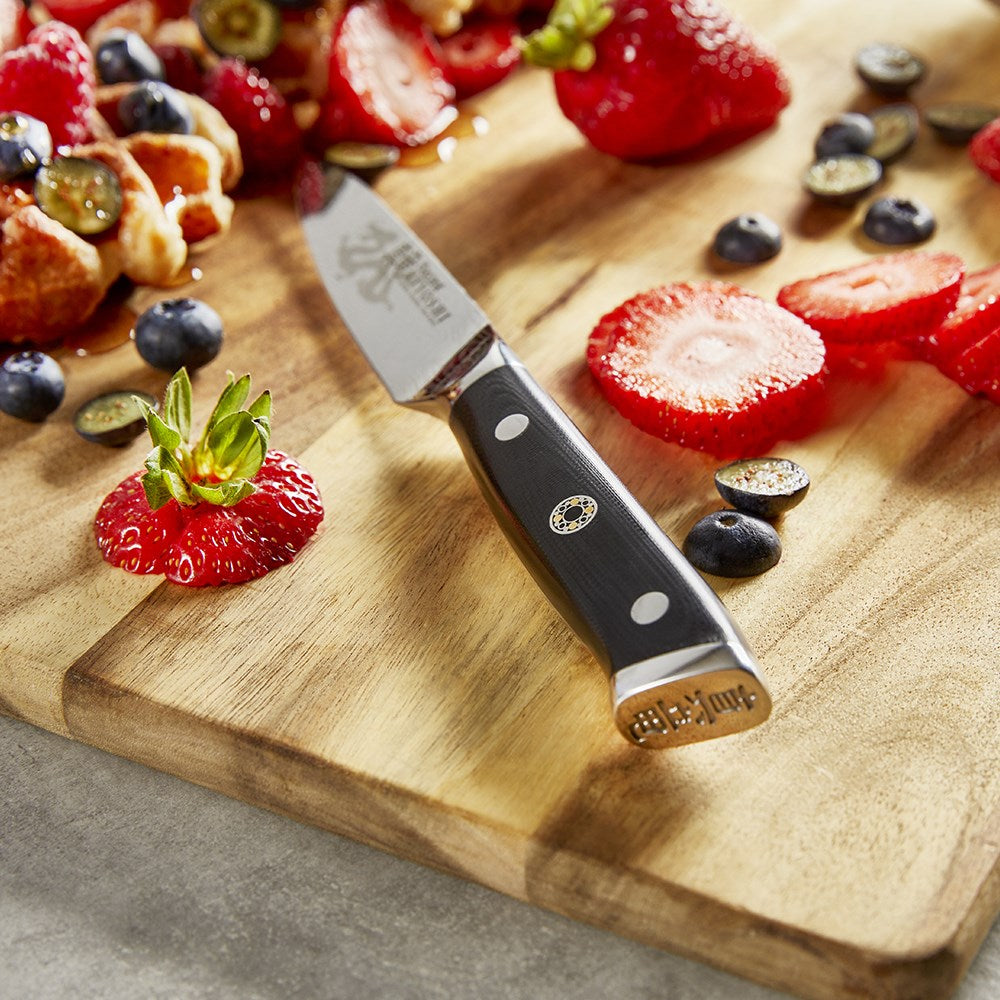 Beautiful Baccarat kiyoshi paring knifes 9cm on a textured surface with decorative fruits - Baccarat