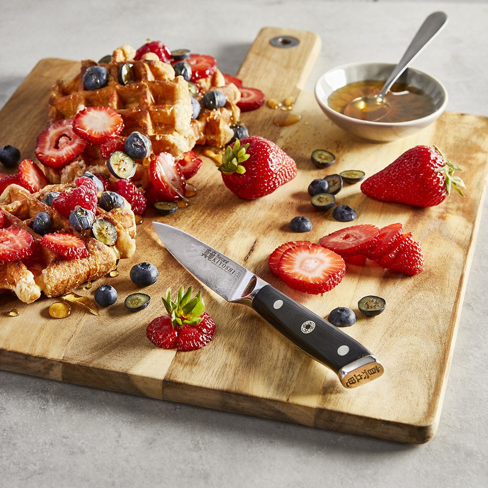 Beautiful Baccarat kiyoshi paring knifes 9cm on a textured surface with decorative fruits - Baccarat