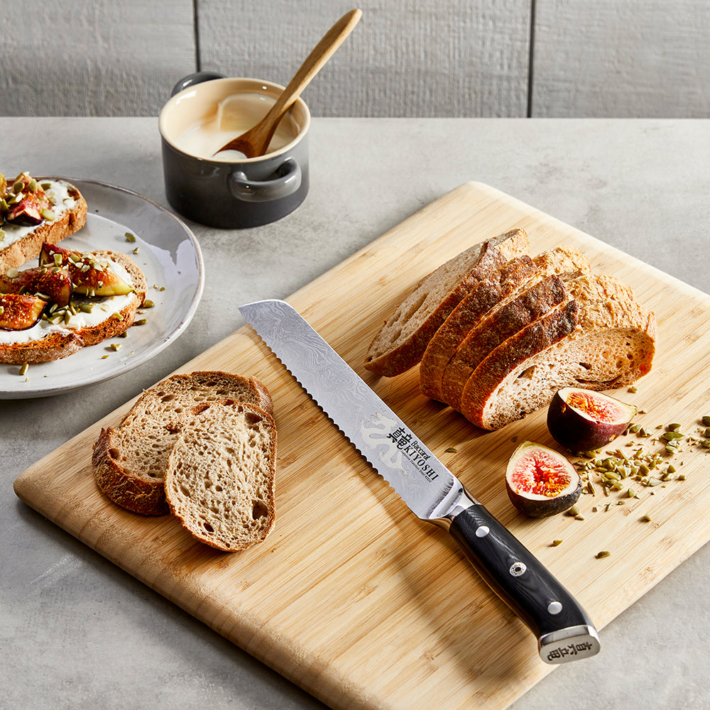 Sliced bread on cutting board with black knife, figs and spread - Baccarat Kiyoshi Bread Knife 20cm