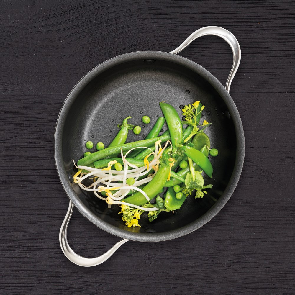 Three dishes on a wooden board with colourful cookware beef rolls noodle stir-fry dessert - Baccarat