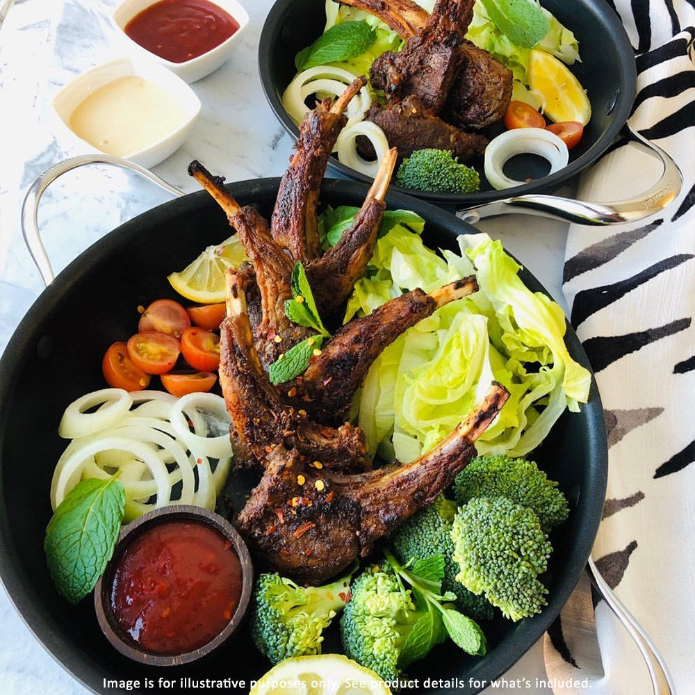 Aerial view of a frying pan filled with fresh green vegetables non-stick serving pan 24cm - Baccarat