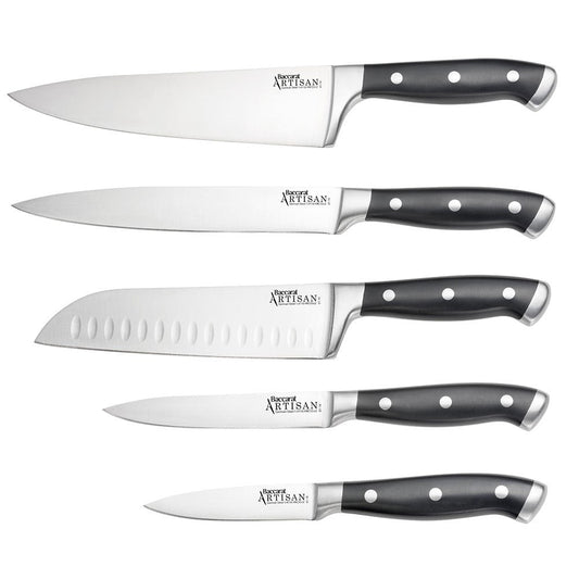 Top view of Baccarat Artisan Finster kitchen knives featuring sleek black handles on a wooden board