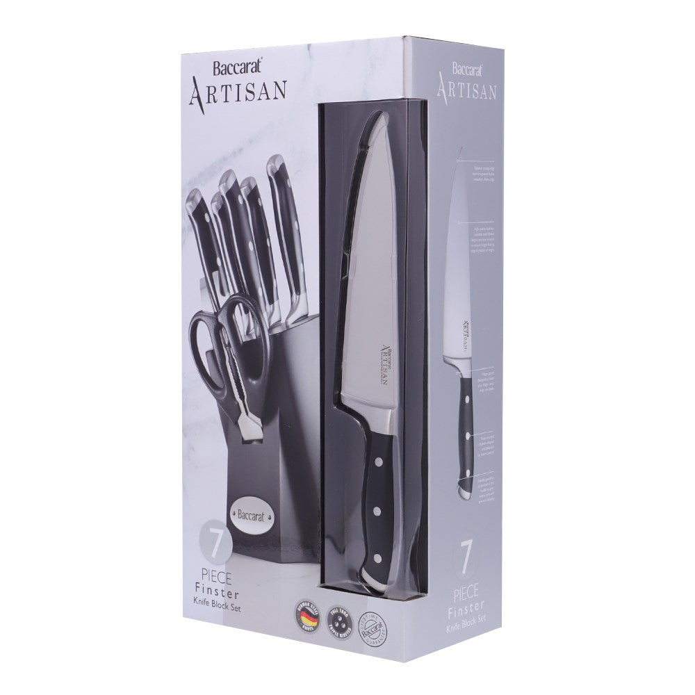 Top view of Baccarat Artisan Finster kitchen knives featuring sleek black handles on a wooden board
