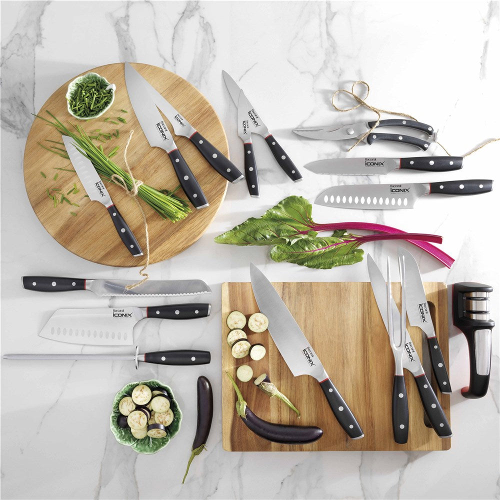 Sleek black-handled carving knife with silver blade beside its Baccarat packaging - Baccarat Iconix