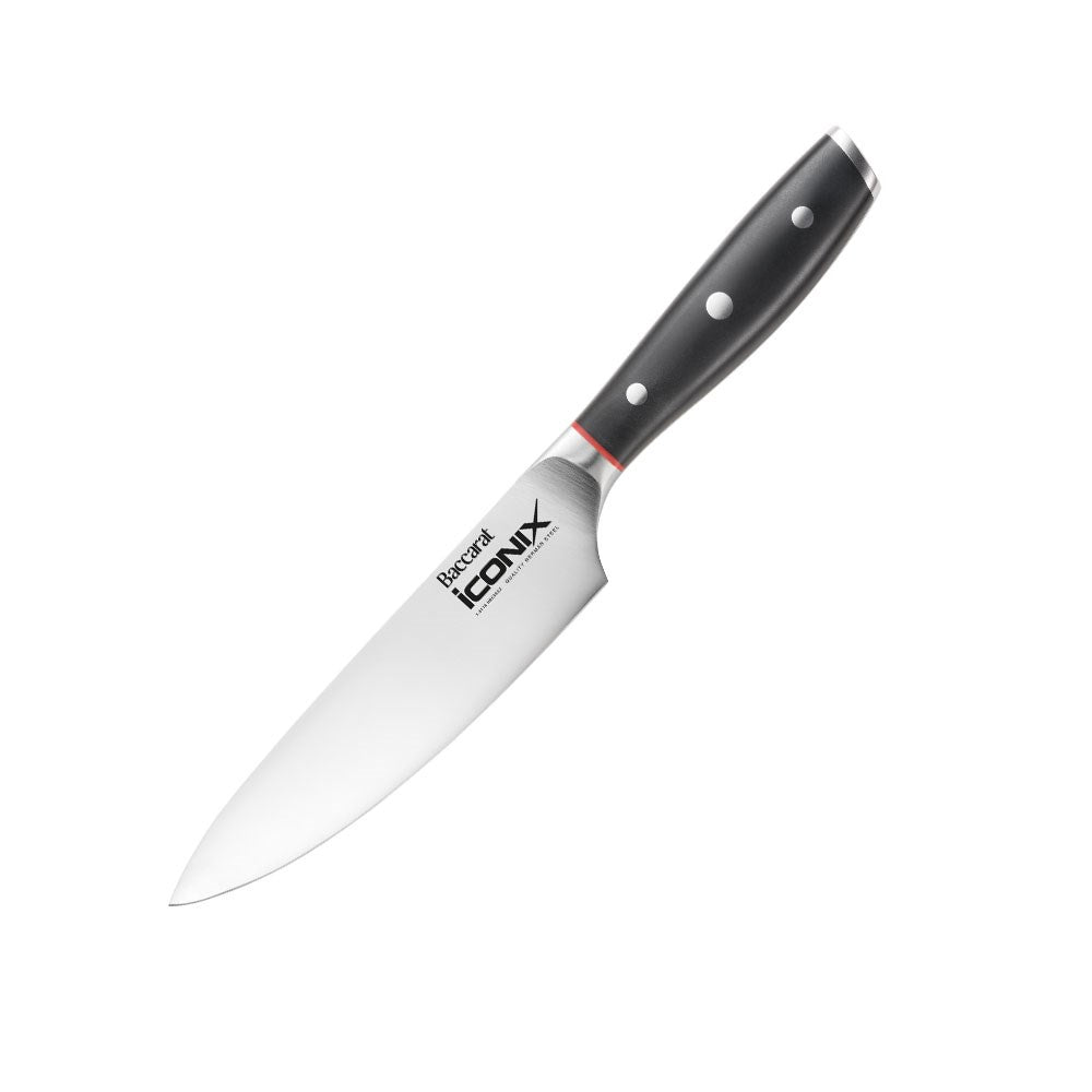 Black-handled chef's knife with red accents on a textured surface 15cm mini chef knife - Baccarat