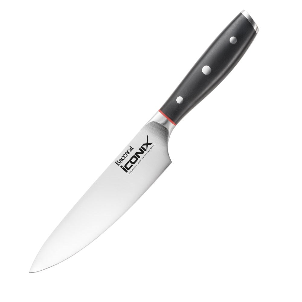 A person chops fennel on a beige countertop green shirt cutting board santoku knife 18cm - Iconix