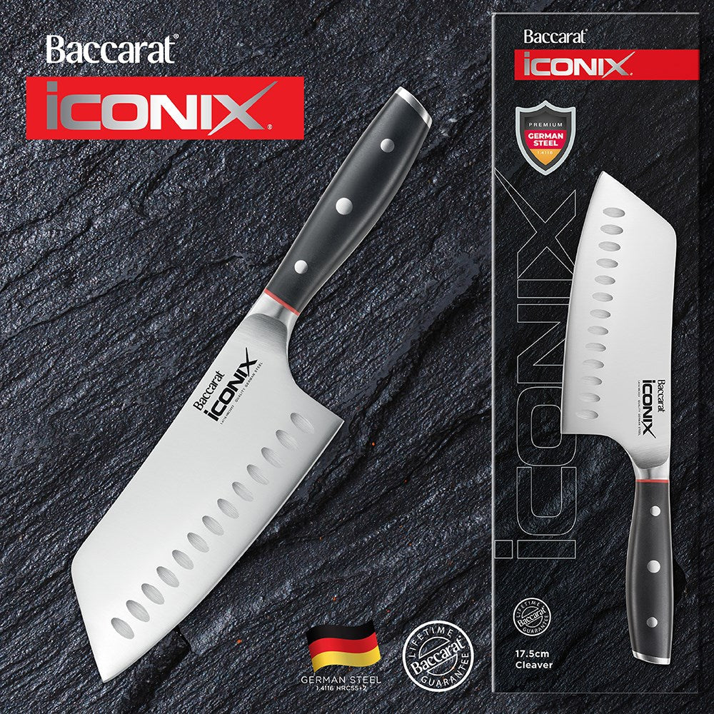 Chopped cauliflower on beige surface next to a silver cleaver knife with a black handle - Baccarat