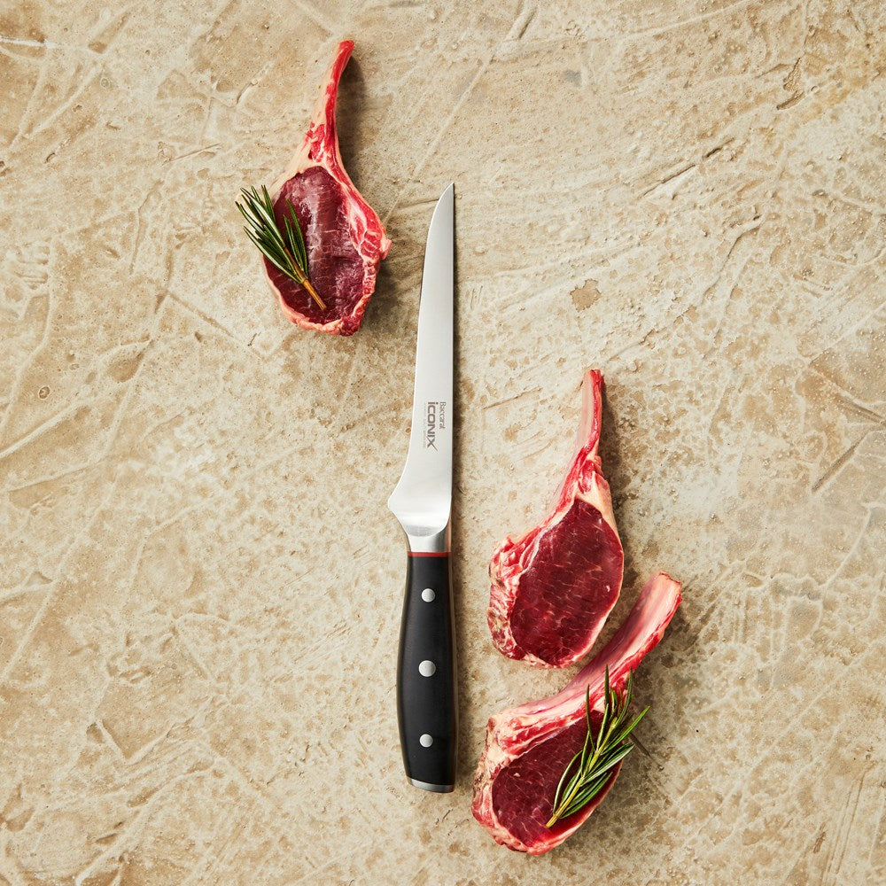 A sharp curved-blade cleaver knife with a black handle and silver accents 17 5cm - Baccarat Iconix