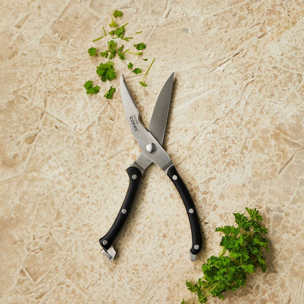 A pair of kitchen shears with black handles and stainless steel blades - Baccarat Iconix Shears