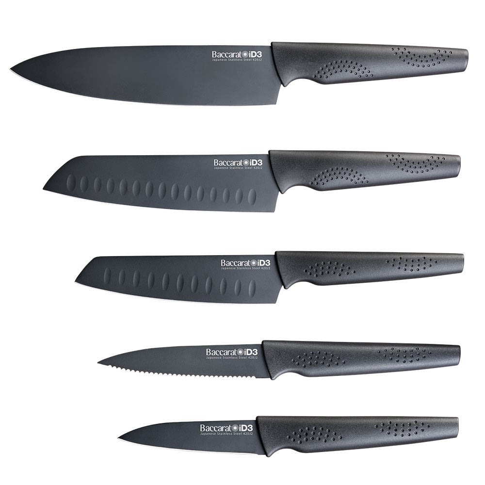 Stylish knife block with six sleek knives and vibrant apples in the background - Baccarat id3 kuro
