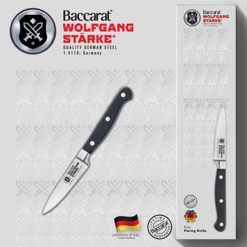 Stainless steel paring knives with a black handle by fresh figs and herbs - Baccarat Wolfgang Starke
