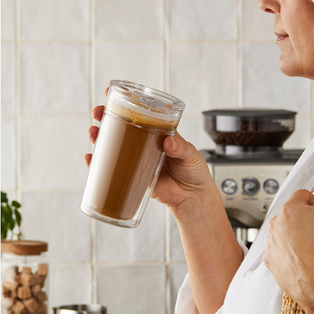 Double walled glass travell coffee cup with layered coffee and milk showcasing pattern - Baccarat