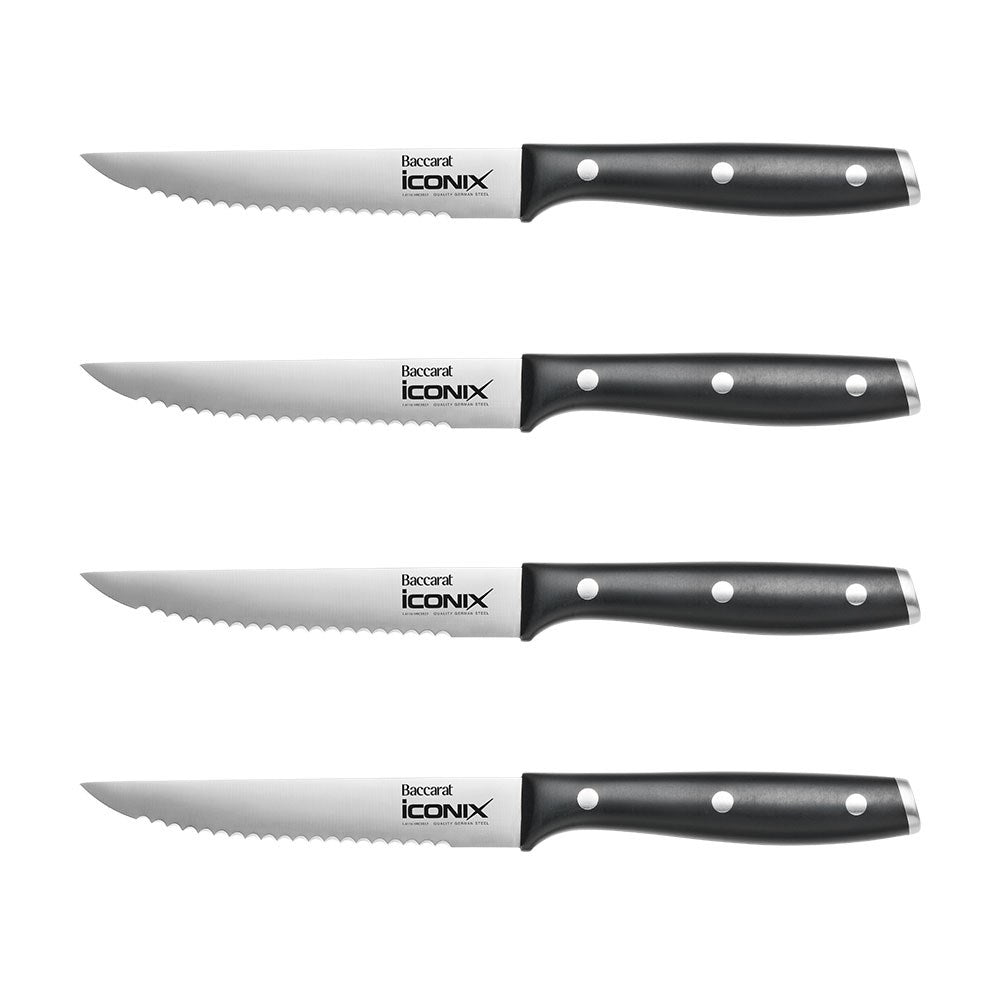 Four stainless steel utility knives aligned horizontally black handles - Baccarat wolfgang starke