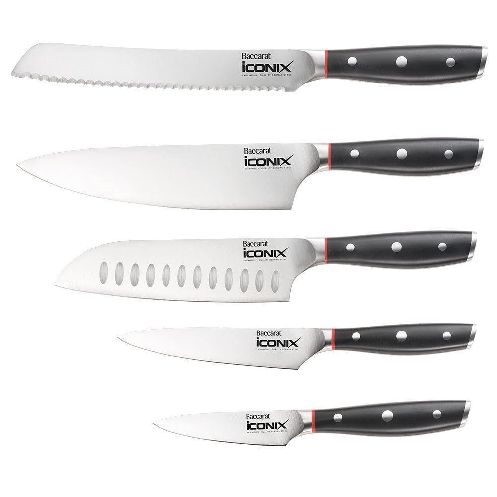 Three stainless steel knives on a dark wood countertop cookware set with egg poacher - Iconix Holz