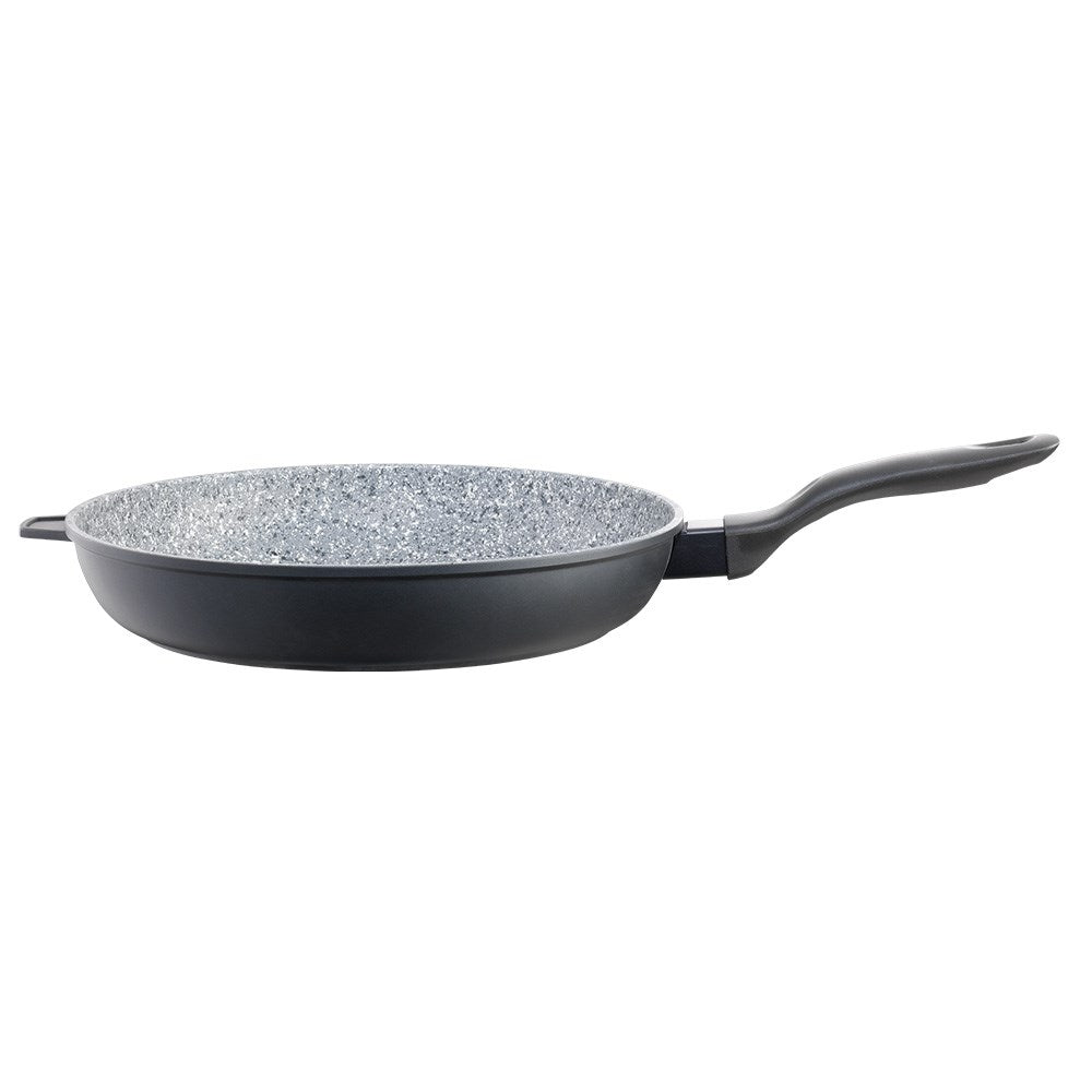 Frying pan with green peas on black surface wooden board with broccoli and onions nearby - Baccarat