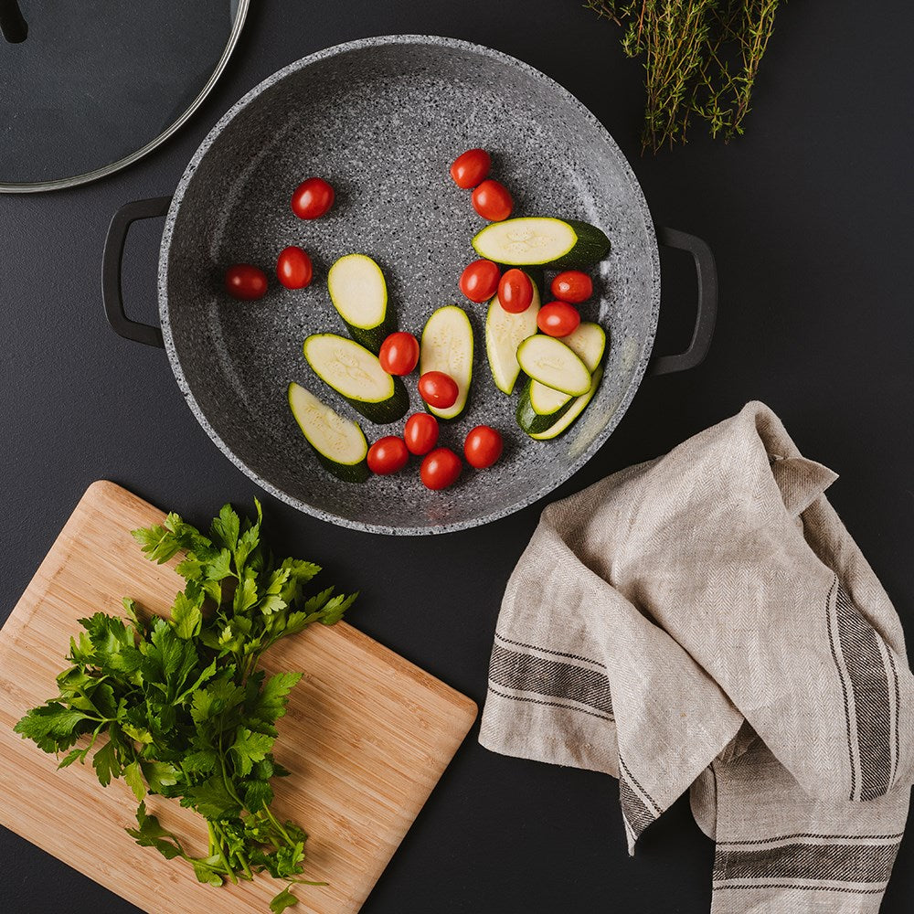 Baccarat Stonex2 Ceramic Saute Pan with lid 32cm with vegetables by a cutting board - Baccarat
