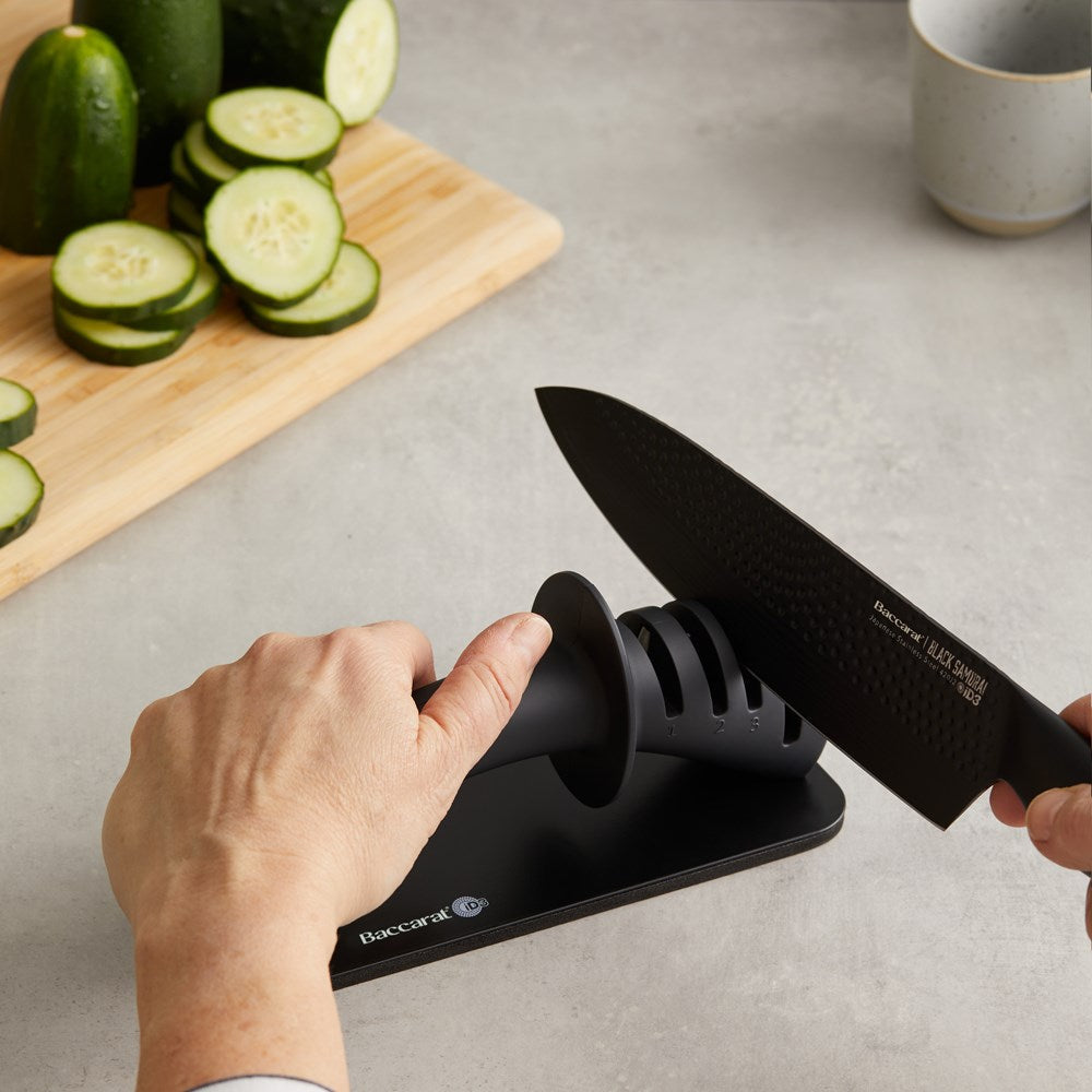 Kitchen knives and sharpeners with vibrant fruits on a dark surface - Baccarat ID3 Black Samurai