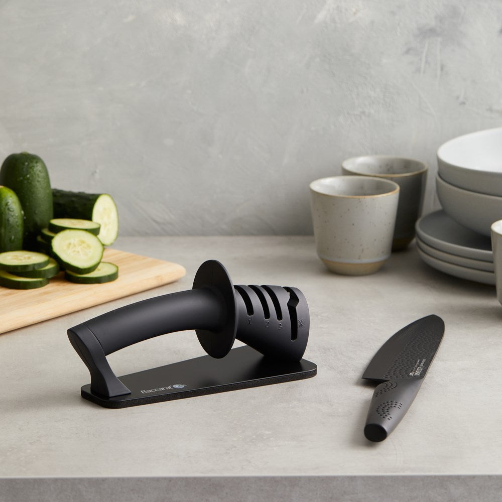 Kitchen knives and sharpeners with vibrant fruits on a dark surface - Baccarat ID3 Black Samurai