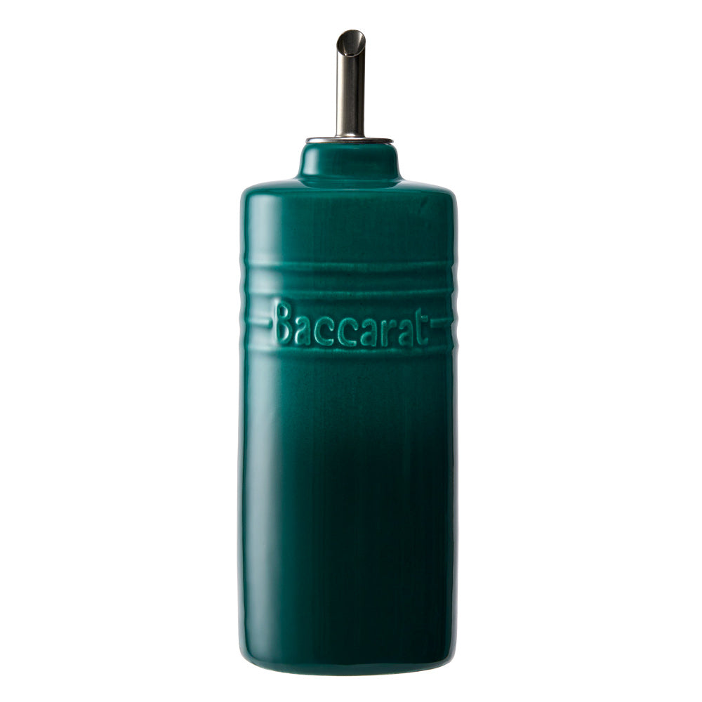 Teal oil bottle elegantly displayed on a vibrant background - Baccarat Le Connoisseur 300ml