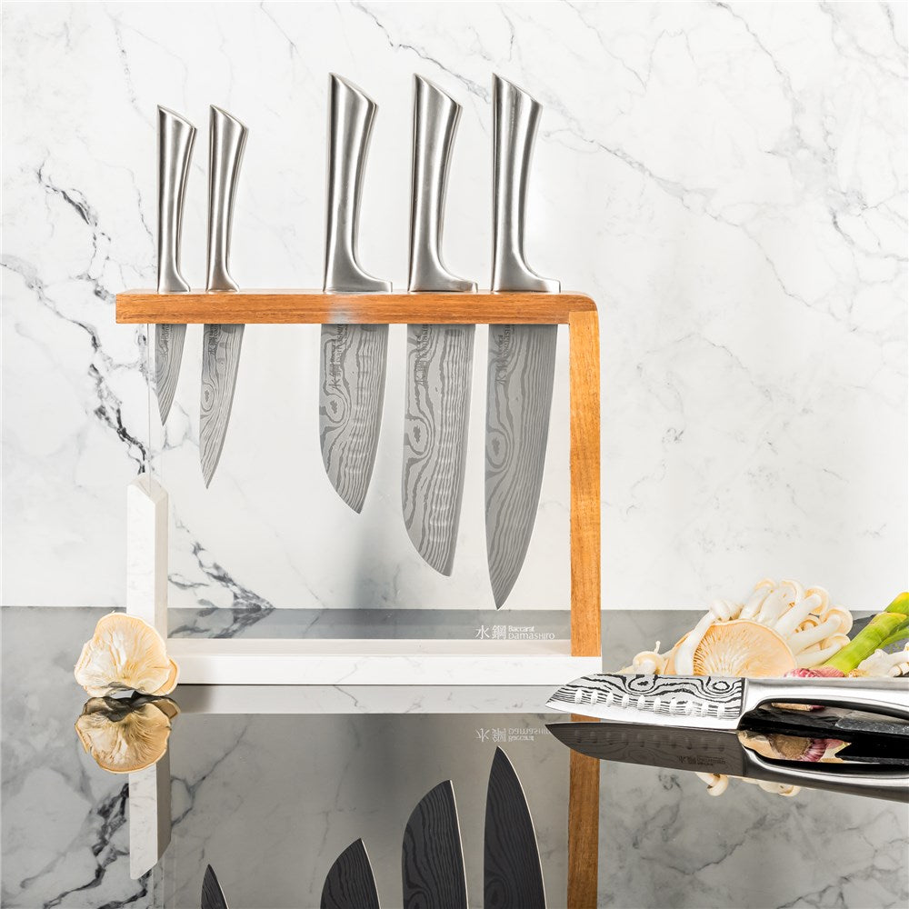 Baccarat Damashiro 7 piece knife block with stainless steel knives on a glossy counter - Baccarat