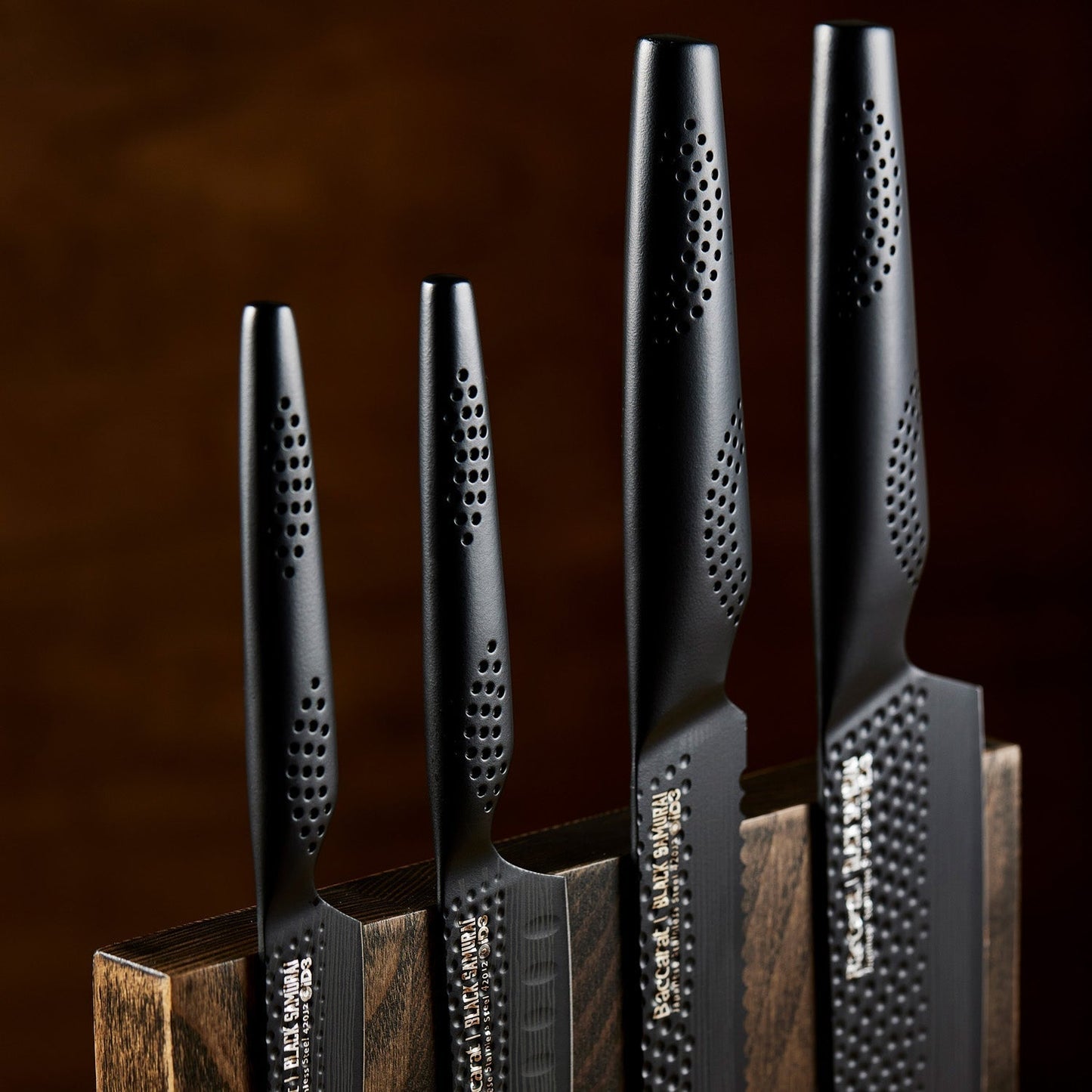 Close-up of two black kitchen knives in a wooden block textured handles colour knives - Baccarat ID3