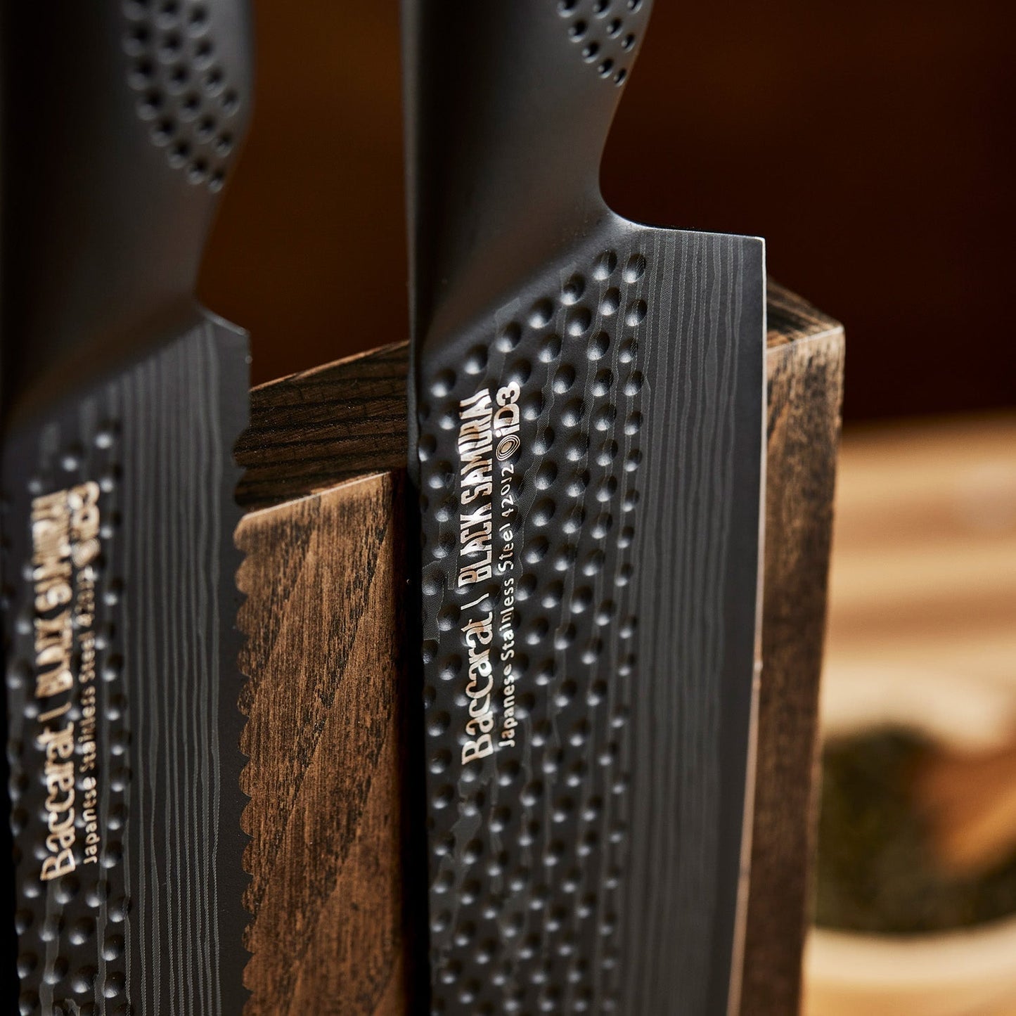 Close-up of two black kitchen knives in a wooden block textured handles colour knives - Baccarat ID3