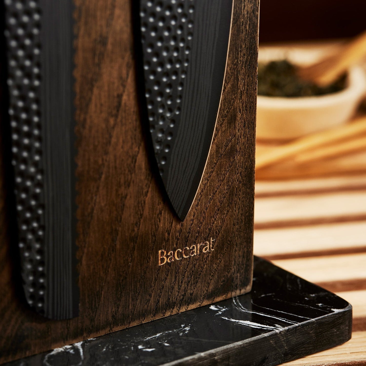 Close-up of two black kitchen knives in a wooden block textured handles colour knives - Baccarat ID3