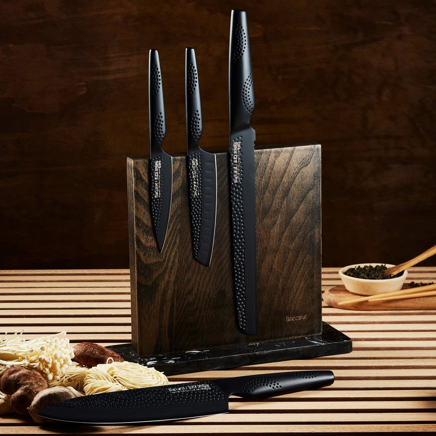 Close-up of two black kitchen knives in a wooden block textured handles colour knives - Baccarat ID3