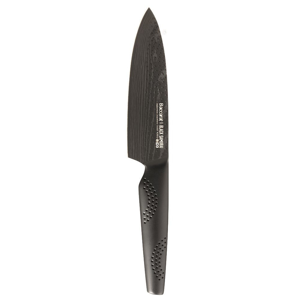 Sharp Black Samurai chef's knife on wooden surface with dried herbs and mushrooms - Baccarat ID3