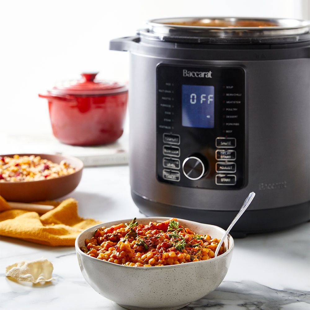 Modern kitchen with a bowl of soup and a black and silver electric mill 19cm - Baccarat spice market