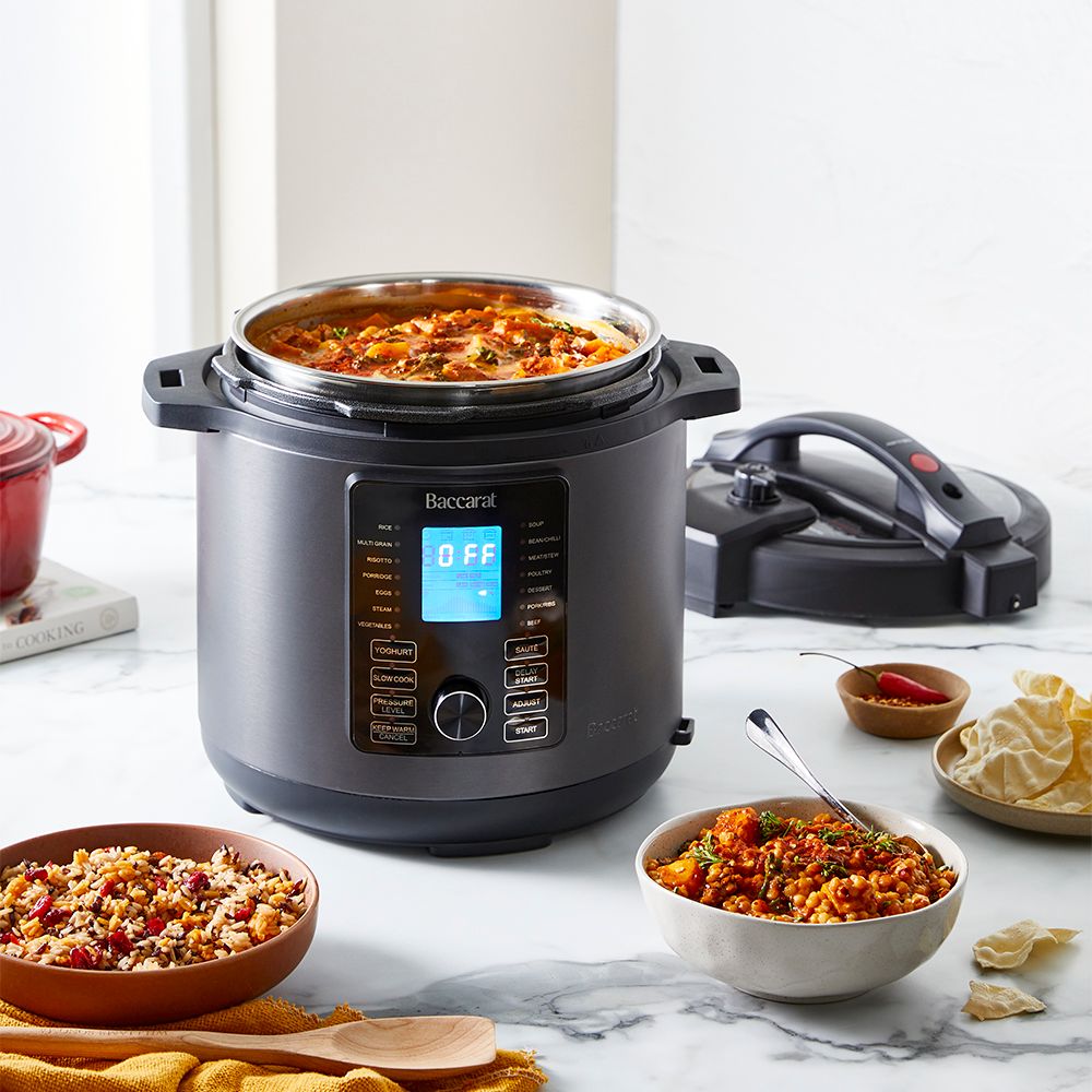 Modern kitchen with a bowl of soup and a black and silver electric mill 19cm - Baccarat spice market