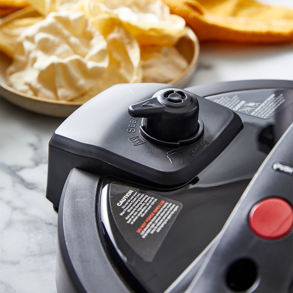 Modern kitchen with a bowl of soup and a black and silver electric mill 19cm - Baccarat spice market
