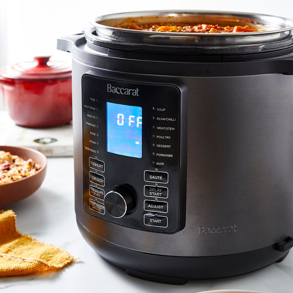 Modern kitchen with a bowl of soup and a black and silver electric mill 19cm - Baccarat spice market