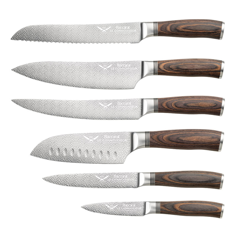 A knife slicing tomatoes on a wooden board silver blade carved handle 8l multicooker black - Epicure