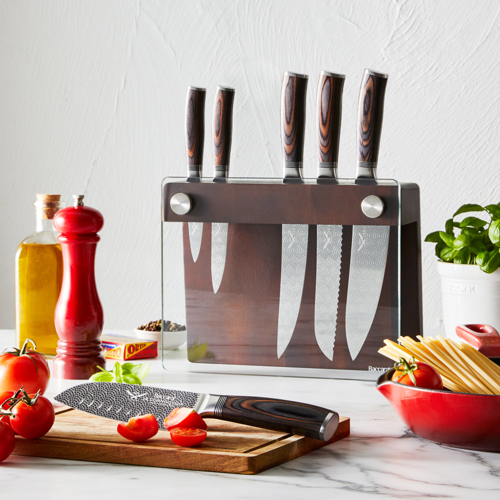 A knife slicing tomatoes on a wooden board silver blade carved handle 8l multicooker black - Epicure