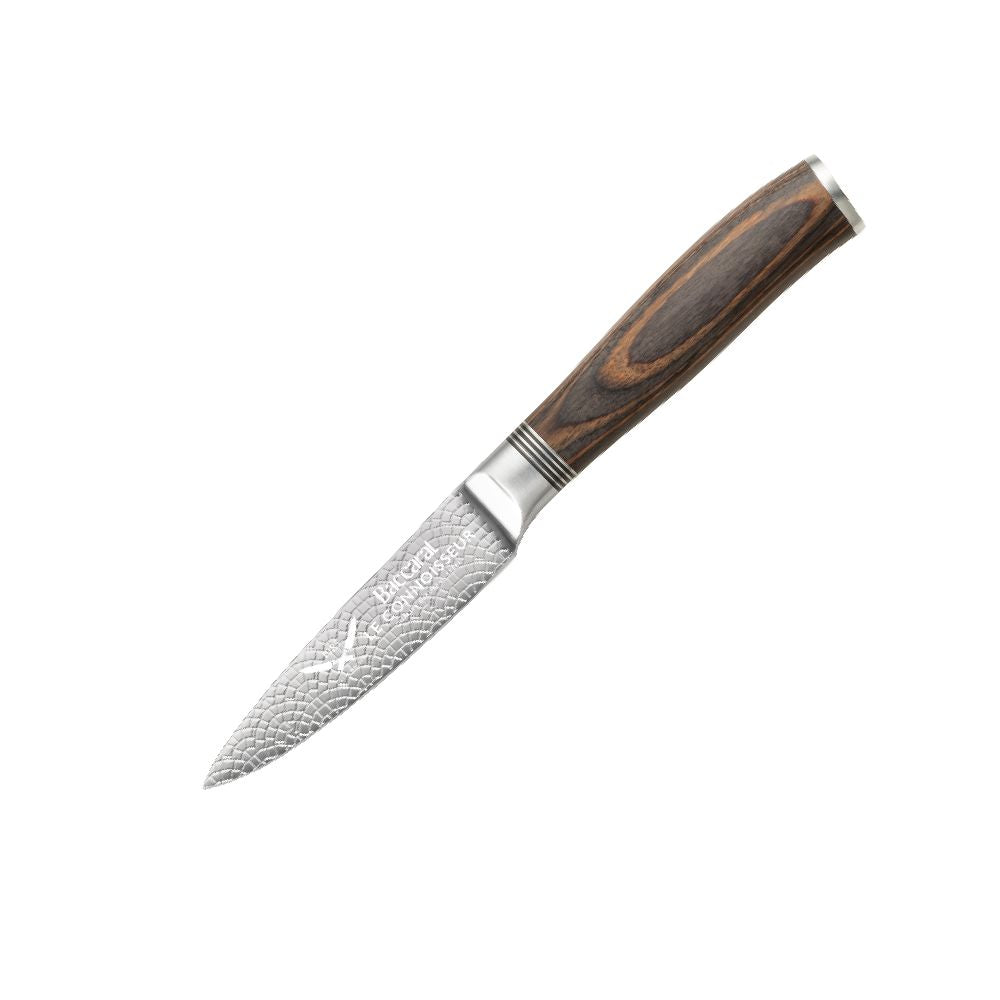 A collection of paring knives displayed on a white textured surface with brown handles - Baccarat