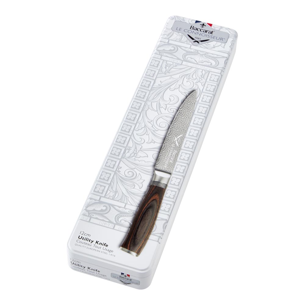 A sleek knife with a wooden handle inside an open silver box brown utility knife 12cm - Baccarat