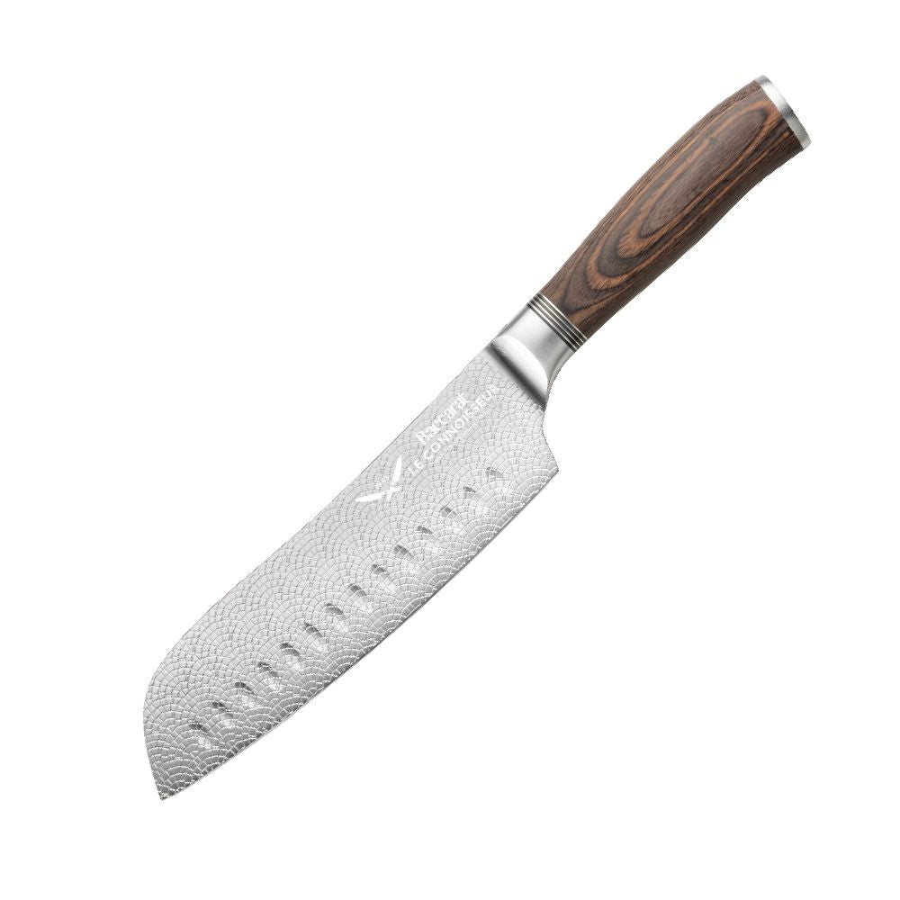 Hands slicing cured sausage on a black slate board metal knife food - Santoku knife 14cm - Baccarat
