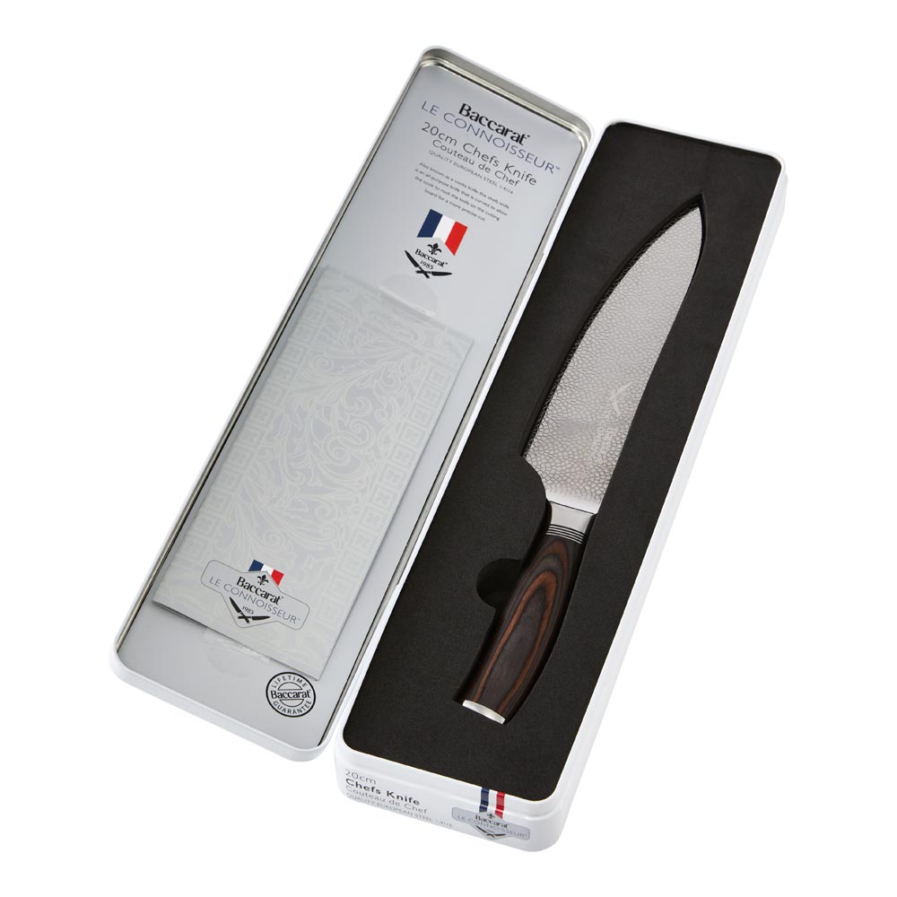 A sleek chefs knife with a sharp stainless steel blade and a dark wood handle colour 20cm - Baccarat