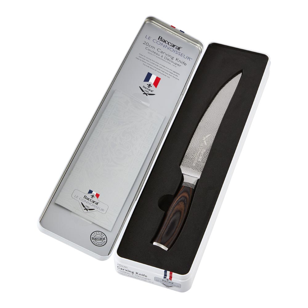 a beautifully crafted carving knife with a sleek wooden handle and fresh sliced tomatoes - Baccarat
