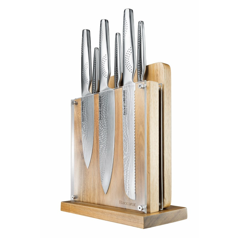 Knife set with silver blades displayed with fruit and nuts on table for precision cutting - Baccarat
