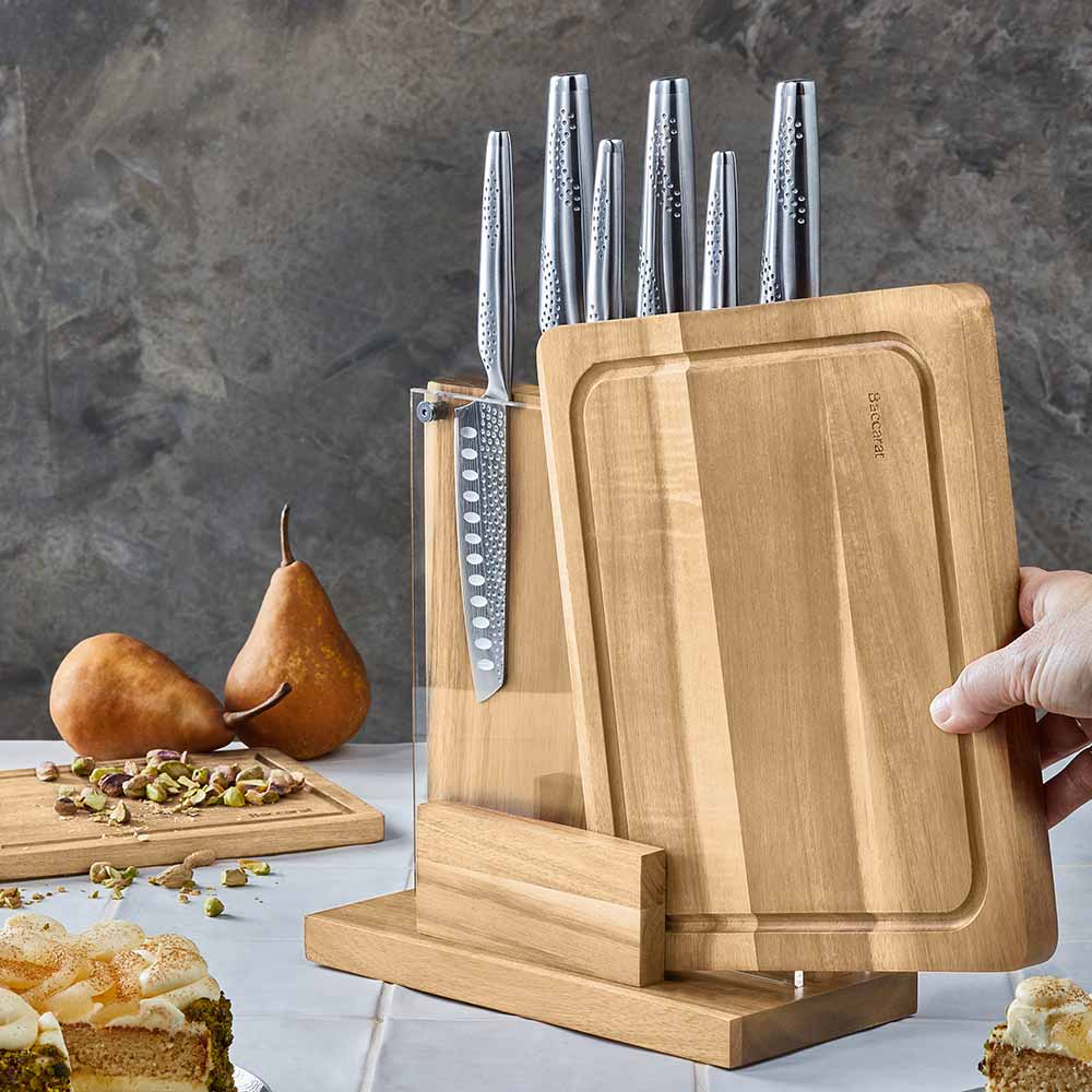 Knife set with silver blades displayed with fruit and nuts on table for precision cutting - Baccarat